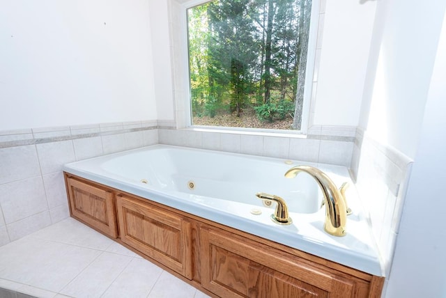 bathroom featuring a tub to relax in and tile patterned flooring