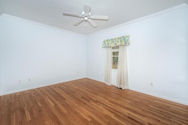 unfurnished room featuring hardwood / wood-style flooring, ceiling fan, and crown molding