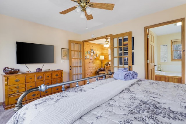 bedroom featuring ceiling fan and connected bathroom