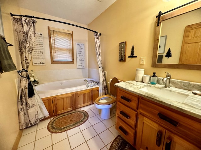 bathroom featuring tile patterned floors, toilet, vanity, and a washtub