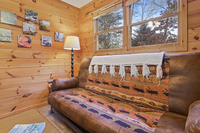 bedroom featuring wooden walls