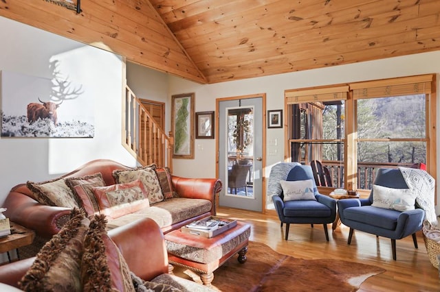 living room featuring wooden ceiling, light hardwood / wood-style floors, and lofted ceiling