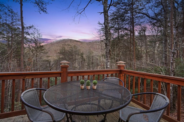 deck at dusk with a mountain view