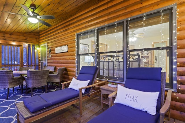 sunroom with ceiling fan and wooden ceiling