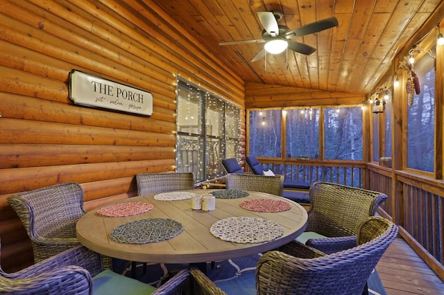 sunroom with ceiling fan, wood ceiling, and lofted ceiling