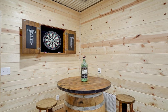 view of sauna with wooden walls