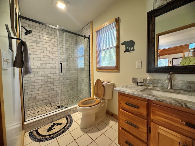 bathroom with vanity, an enclosed shower, toilet, and tile patterned floors