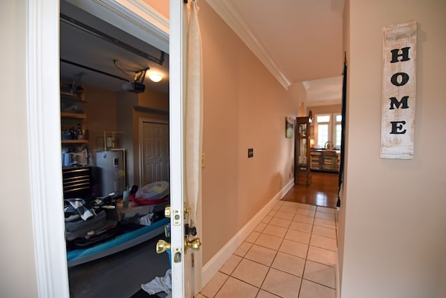 hallway featuring crown molding, electric water heater, and light tile patterned floors