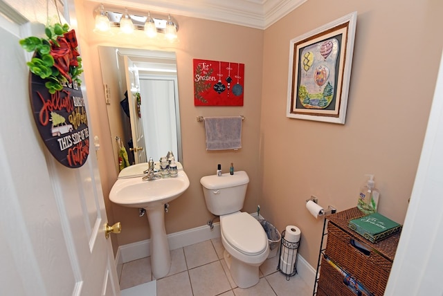 bathroom with ornamental molding, tile patterned floors, and toilet