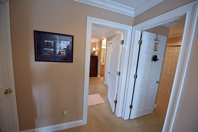 hall featuring light carpet and ornamental molding