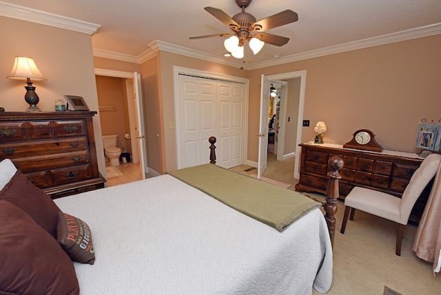 bedroom featuring crown molding, ensuite bath, a closet, and ceiling fan