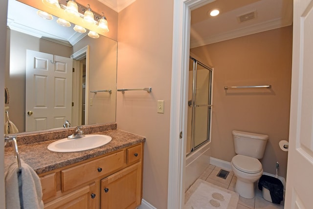 full bathroom with shower / bath combination with glass door, tile patterned flooring, vanity, toilet, and crown molding