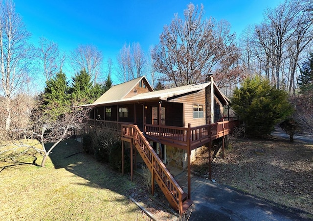 view of front of house featuring a wooden deck