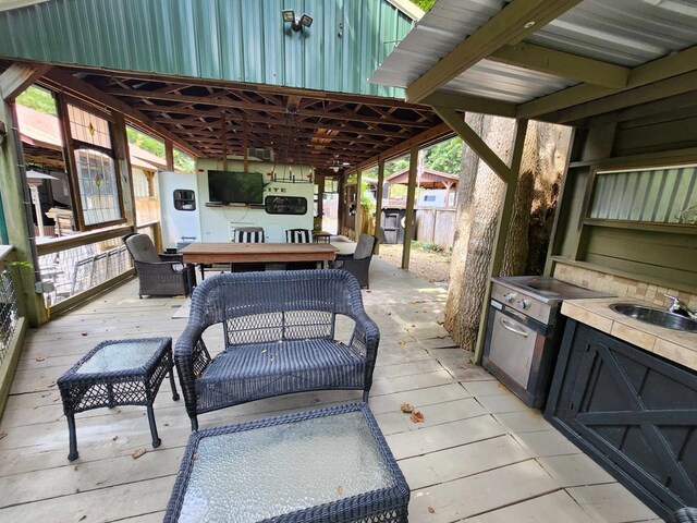 exterior space with sink and a deck