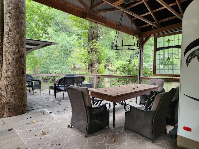 view of patio with an outdoor living space, a deck, and a gazebo