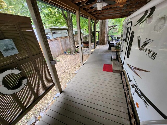 wooden terrace with ceiling fan