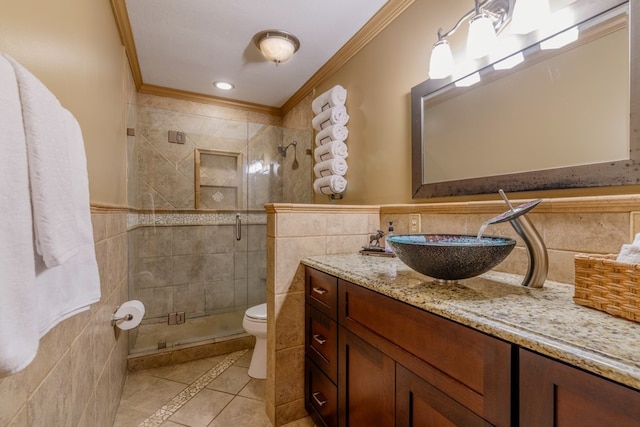 bathroom featuring tile walls, toilet, tile flooring, an enclosed shower, and vanity