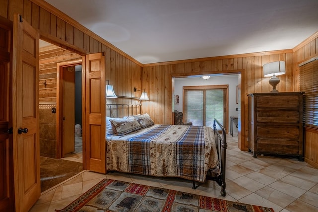 bedroom featuring crown molding, wood walls, and light tile floors