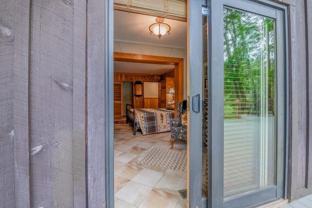 exterior space with tile floors and ornamental molding