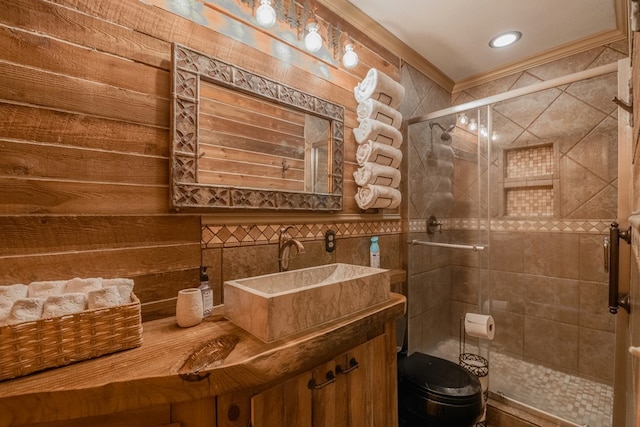 bathroom with a shower with shower door, vanity, and toilet