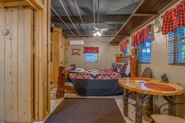 basement with tile floors, ceiling fan, and an AC wall unit