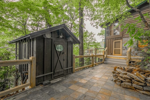 view of patio / terrace with a shed