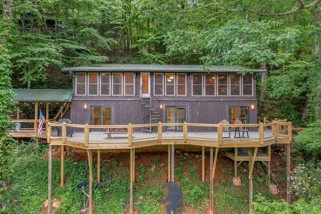 rear view of property with a wooden deck