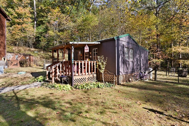 view of outbuilding with a yard