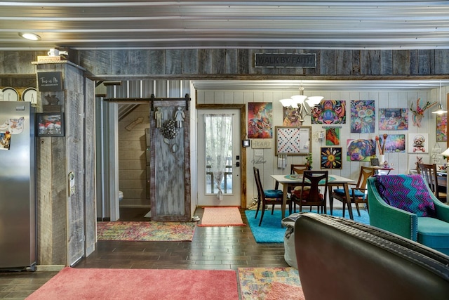 interior space featuring an inviting chandelier and dark hardwood / wood-style flooring