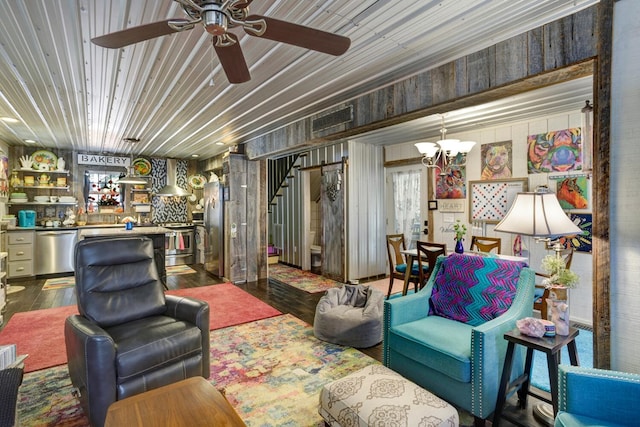 interior space featuring hardwood / wood-style floors and ceiling fan with notable chandelier