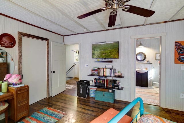 interior space with sink, ceiling fan, and dark hardwood / wood-style flooring