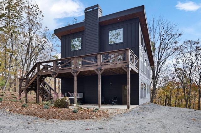 1250 Lost Forest Rd, Ellijay, GA 30536 - rear view of property with a patio area, stairway, a deck, and board and batten siding