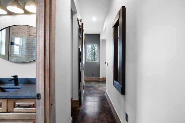 1250 Lost Forest Rd, Ellijay, GA 30536 - hallway featuring baseboards, a sink, and recessed lighting