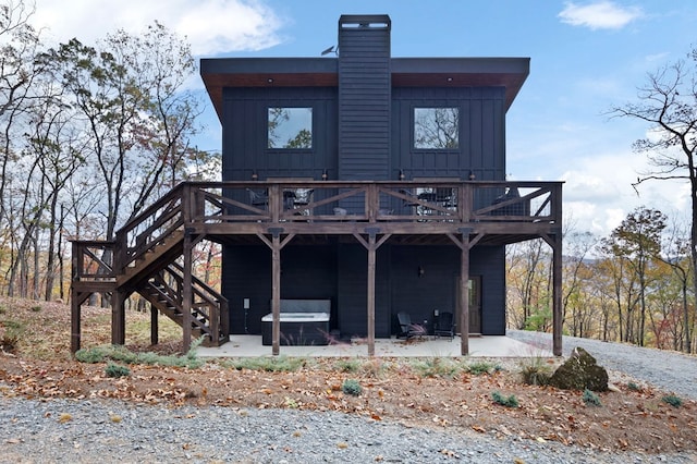 1250 Lost Forest Rd, Ellijay, GA 30536 - rear view of house with stairs, a deck, a patio, and board and batten siding