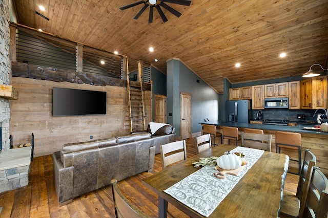 1250 Lost Forest Rd, Ellijay, GA 30536 - dining space featuring wood ceiling, a ceiling fan, wooden walls, and light wood-type flooring