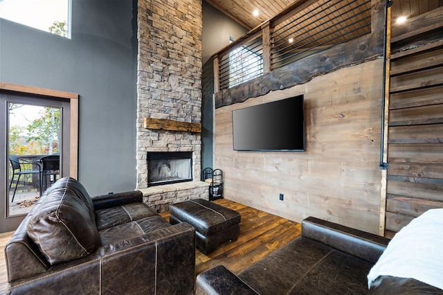 1250 Lost Forest Rd, Ellijay, GA 30536 - living area featuring wood ceiling, wood finished floors, a towering ceiling, and a fireplace