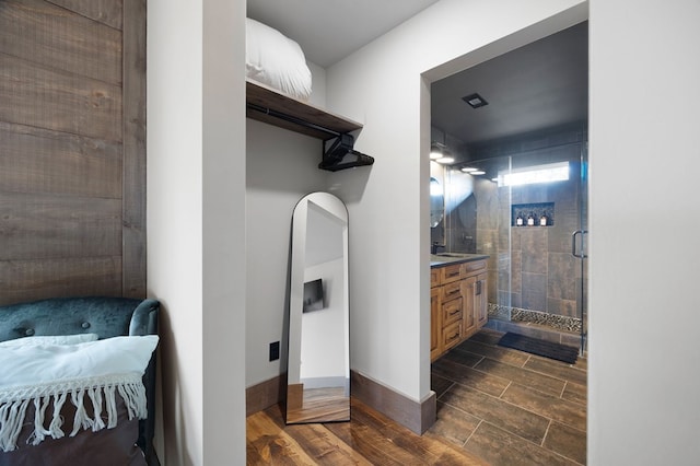 1250 Lost Forest Rd, Ellijay, GA 30536 - full bathroom featuring baseboards, vanity, wood finished floors, and a shower stall