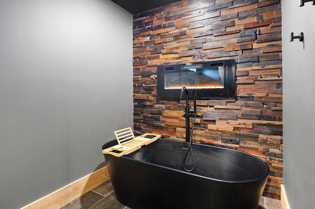 1250 Lost Forest Rd, Ellijay, GA 30536 - interior details with wooden walls, wood finished floors, baseboards, and a sink