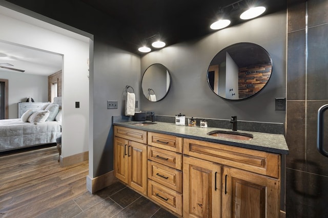 1250 Lost Forest Rd, Ellijay, GA 30536 - full bath featuring wood finished floors, ensuite bath, a sink, and double vanity