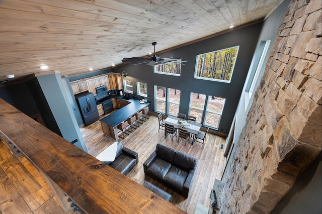 1250 Lost Forest Rd, Ellijay, GA 30536 - living room with recessed lighting, wood finished floors, wood ceiling, high vaulted ceiling, and ceiling fan