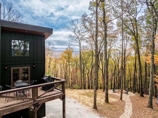 1250 Lost Forest Rd, Ellijay, GA 30536 - exterior space with a wooden deck and a forest view