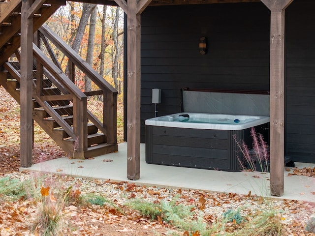 1250 Lost Forest Rd, Ellijay, GA 30536 - view of patio featuring cooling unit, a hot tub, and stairs
