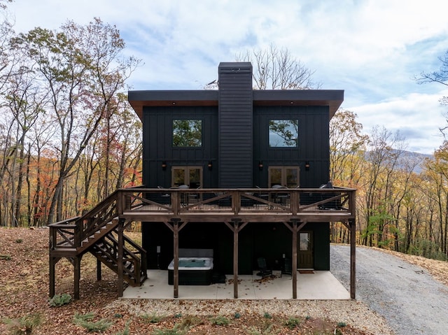 1250 Lost Forest Rd, Ellijay, GA 30536 - rear view of property with a patio area, a chimney, a deck, board and batten siding, and french doors
