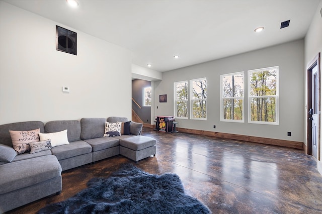 1250 Lost Forest Rd, Ellijay, GA 30536 - living room featuring concrete flooring, baseboards, stairs, and recessed lighting