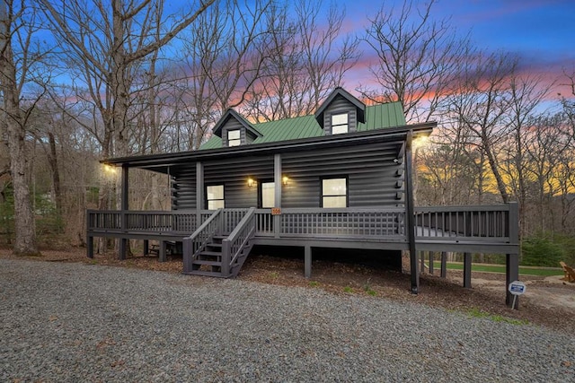 log cabin featuring a porch