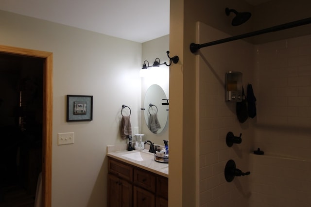 bathroom with a shower and vanity