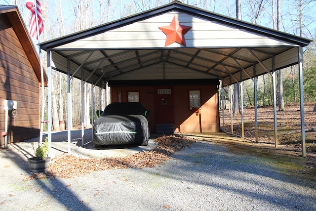 view of vehicle parking with a carport