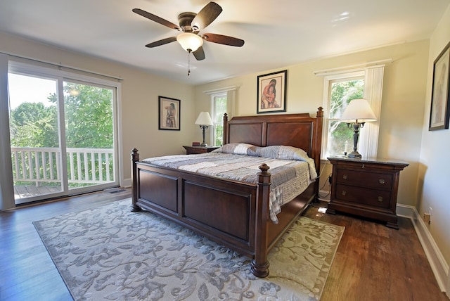 bedroom with access to exterior, ceiling fan, and dark hardwood / wood-style floors