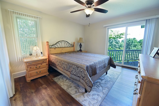 bedroom with access to outside, ceiling fan, and dark wood-type flooring