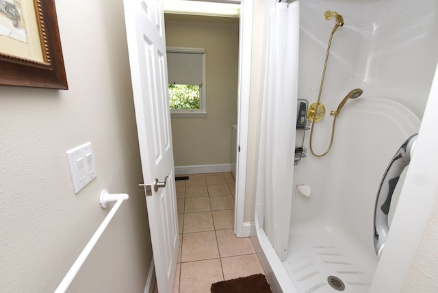 bathroom featuring tile patterned flooring and a shower with shower curtain